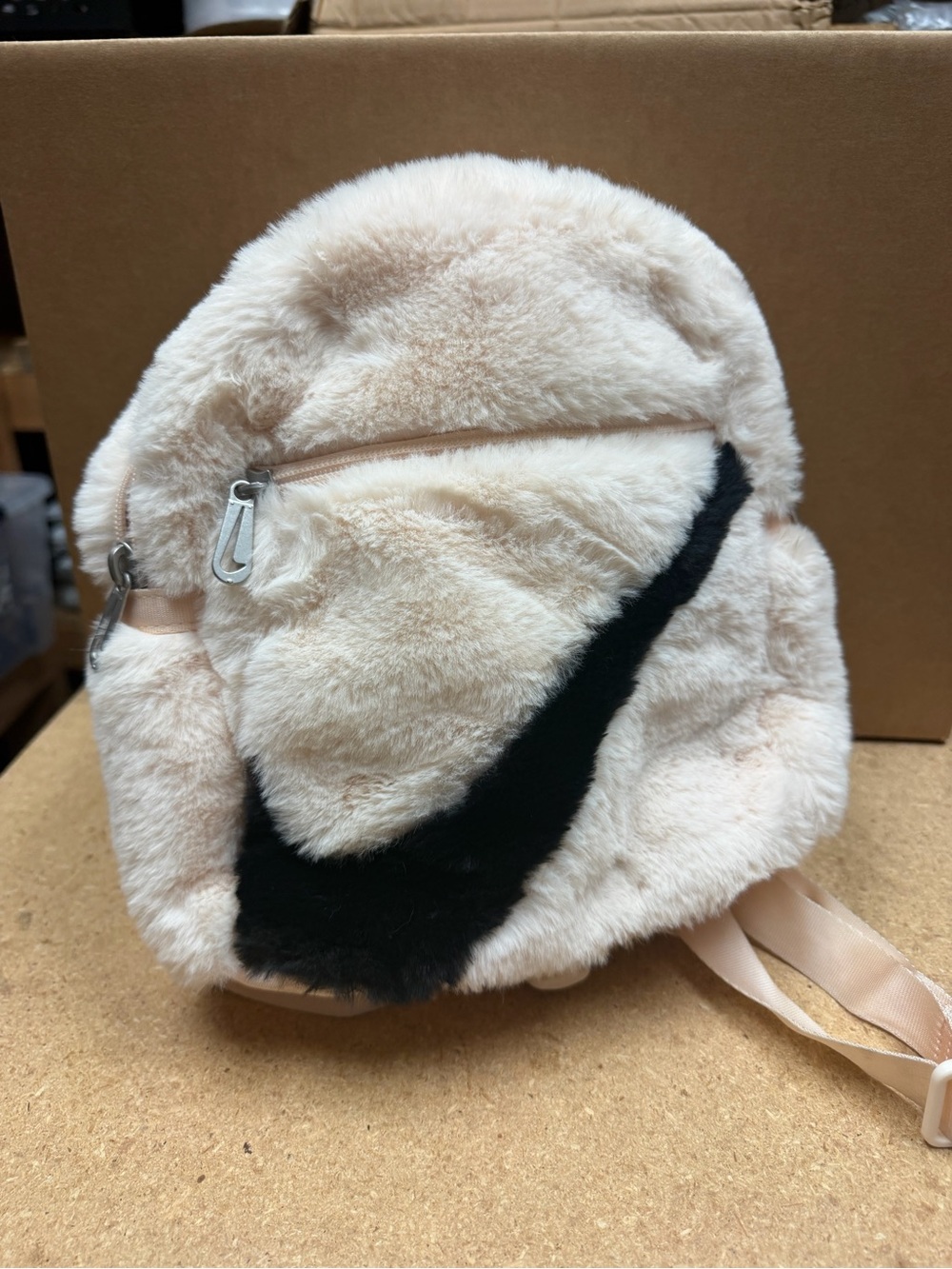 Nike Plush Mini Backpack in light pink with Black Swoosh